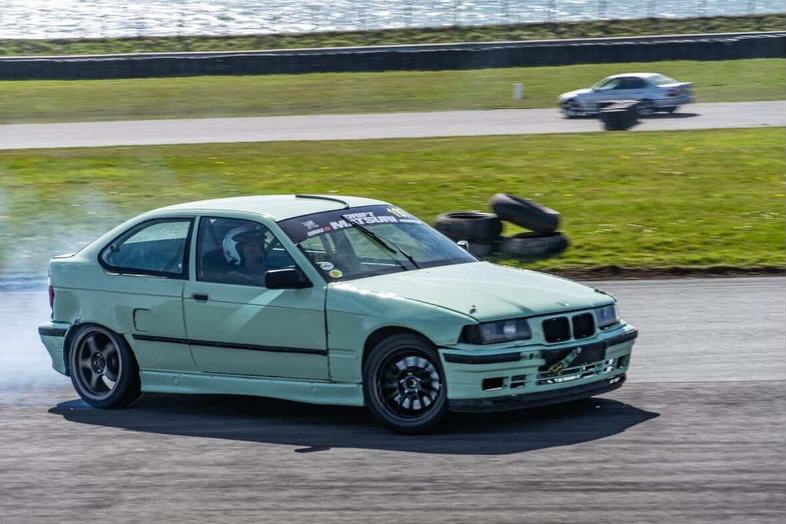 Charlie's mint green BMW E36 Compact drifting at Matsuri
