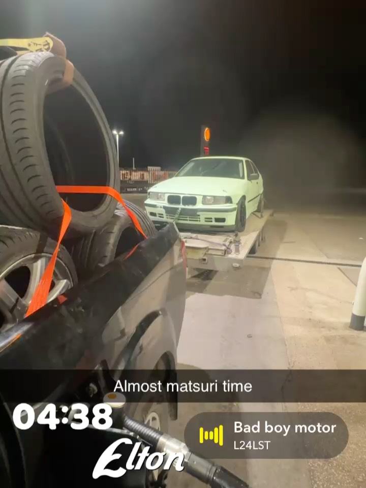 The E36 Compact on a trailer at night before Matsuri
