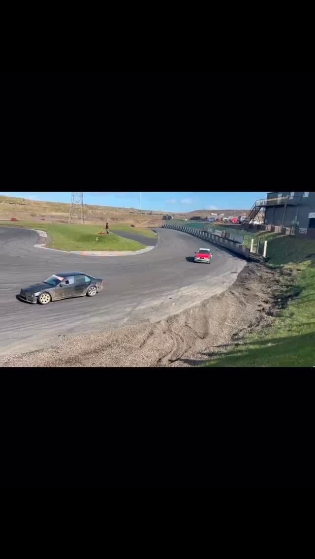 Cars drifting around the Driftland circuit