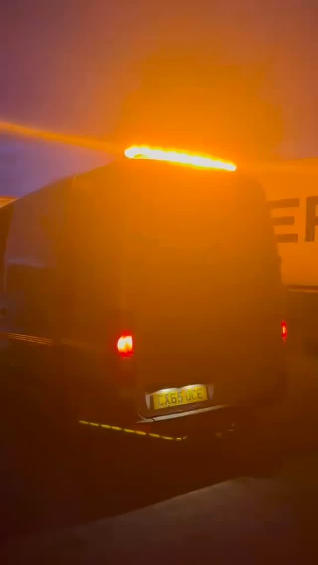 The van at night with amber beacons on